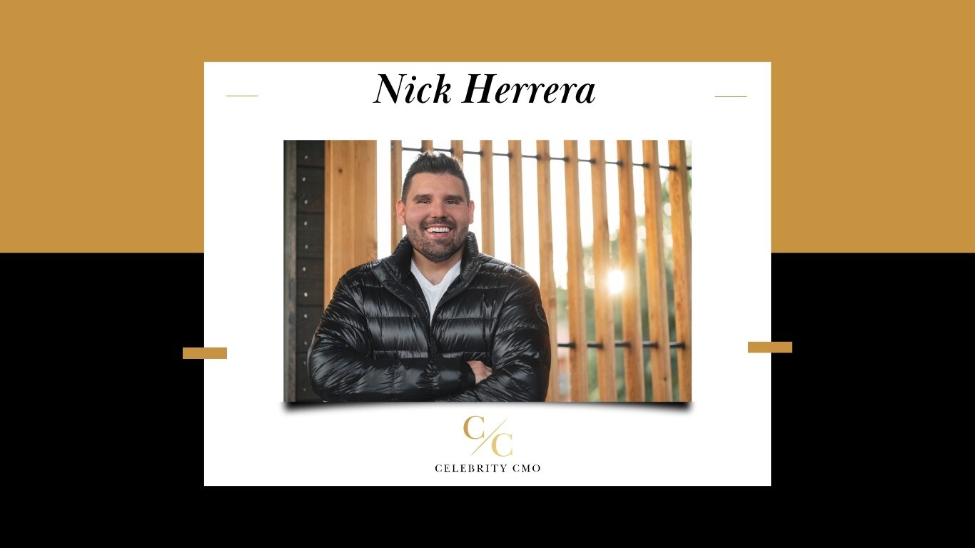 Nick Herrera, Fractional CMO and Founder of Celebrity CMO smiles brightly against wood lattice backdrop